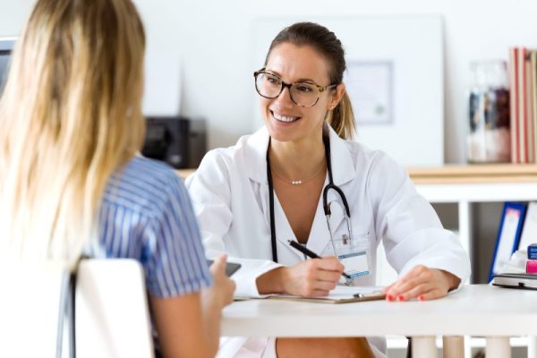 Female doctor explaining diagnosis to her patient. Portrait of female doctor explaining diagnosis to her patient.